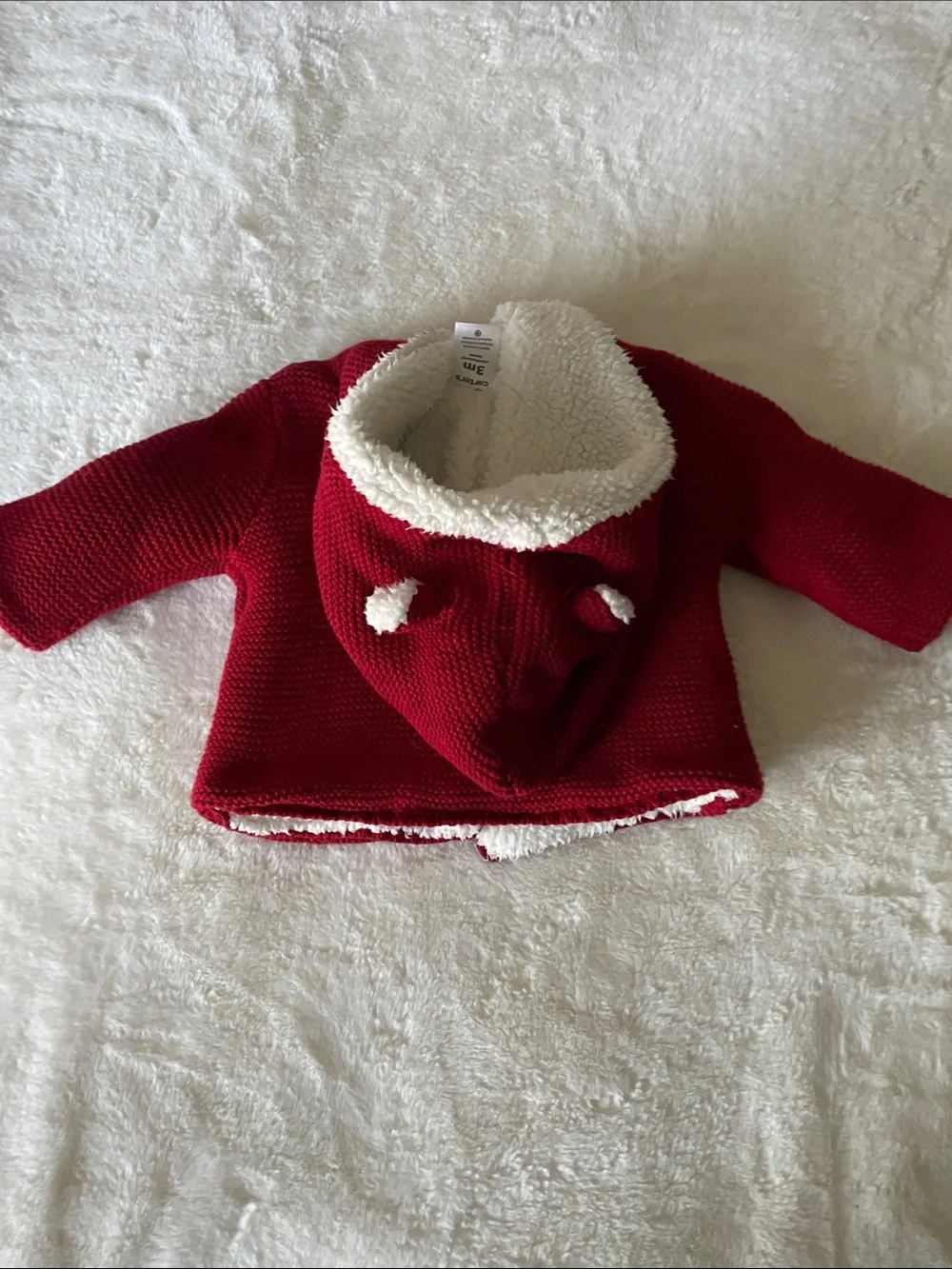 Carter’s size 3 mos fleece-lined red knit cardigan w/hood